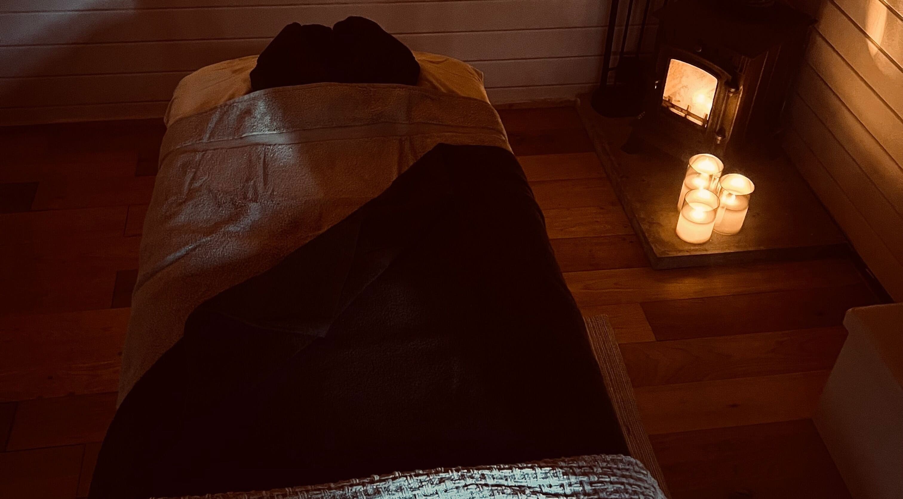 Relaxing spa bed with candles at Allthingsbeauty_bykatiex, Pershore, England, GB for ultimate tranquility.