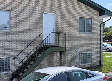 The exterior view of Naturally Auinye located in Eastpointe, Michigan, US, showcasing its distinctive brick facade.