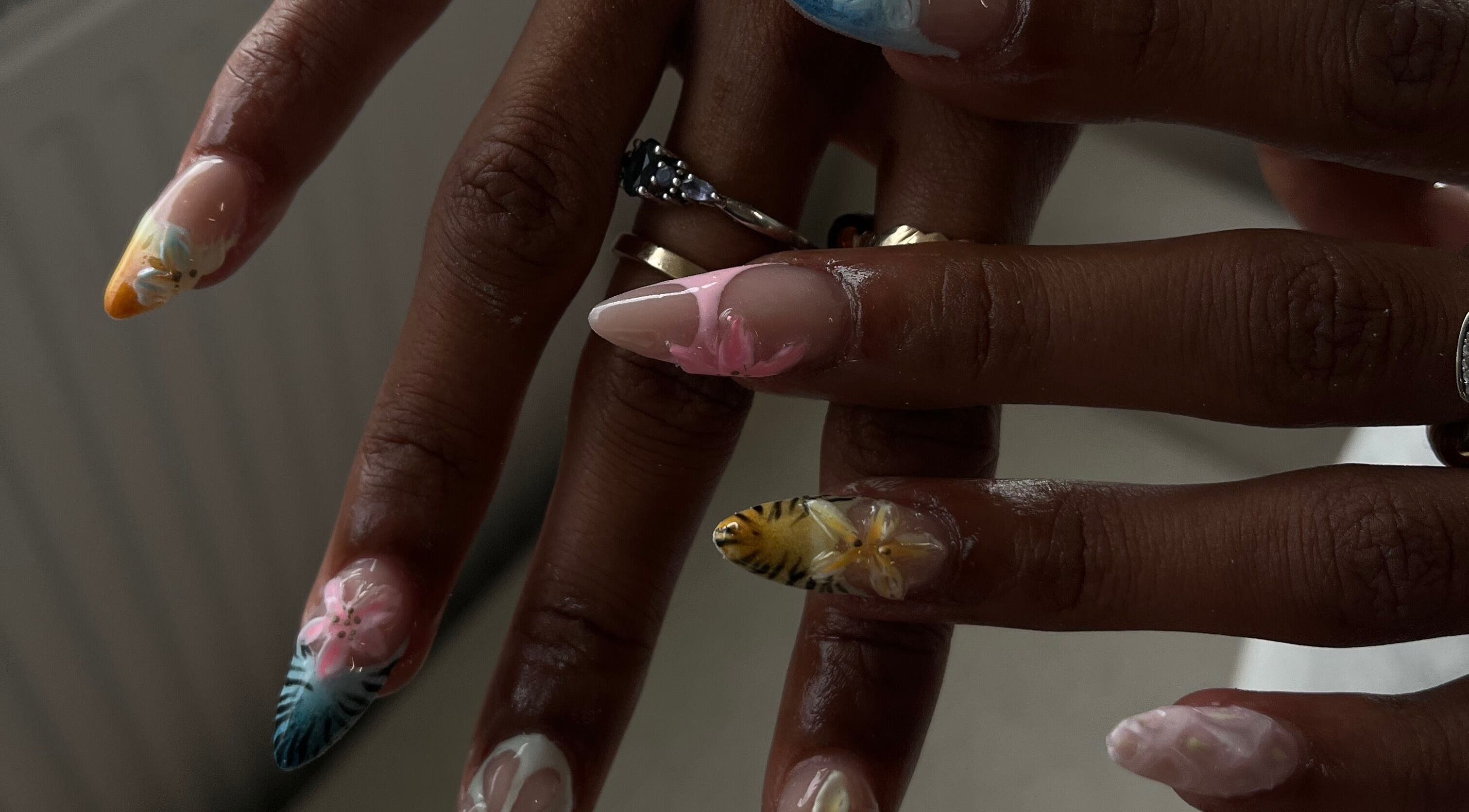 Intricate nail art at Nails By Wik in Doncaster, England, GB, showcasing vibrant floral designs.
