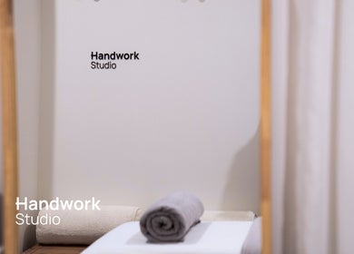 Relaxing spa at Handwork Studio, Windsor, Victoria, AU with cozy towels and ambient lighting.