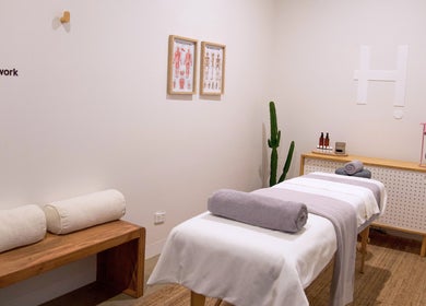 Relaxing massage room at Handwork Studio, Melbourne, Victoria, AU with a cozy setup and minimalist decor.