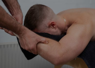 Man receiving an arm massage at Handwork Studio, Melbourne, Victoria, AU. Boost wellness and relaxation.