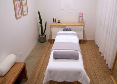 A serene massage room at Handwork Studio, Melbourne, Victoria, AU with modern decor and soft lighting.