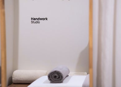 Relaxing treatment room at Handwork Studio, Melbourne, Victoria, AU with soft linens and calming decor.