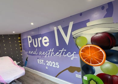 Interior of Pure IV and Aesthetics, Sarisbury Green, England, GB, featuring a treatment chair and artistic wall design.