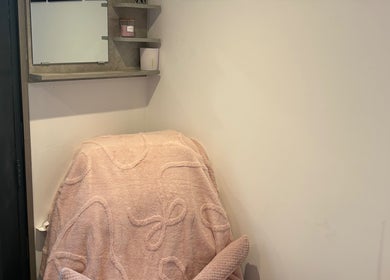 Relaxing corner with a plush pink chair at Pure IV and Aesthetics, Sarisbury Green, England, GB.