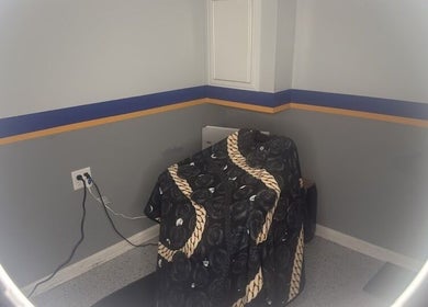 Cozy barber station at Daniel M Barbershop, Ashland, Massachusetts, US with a stylish chair cover.
