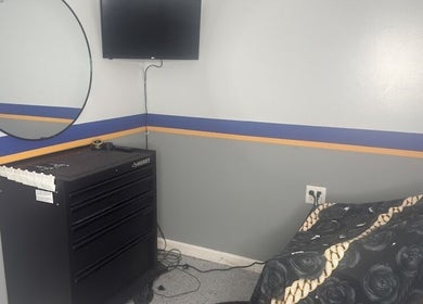 Contemporary barber station at Daniel M Barbershop in Ashland, Massachusetts, US featuring sleek decor.