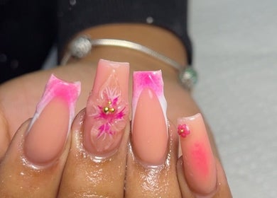 Intricate floral nail art at Sheia’s Nail Gallery, Nassau, New Providence, BS with pink accents.