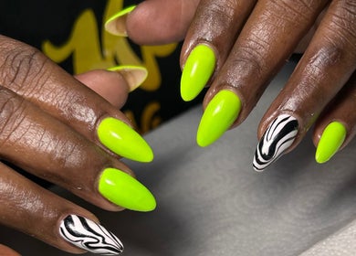 Bright green nails with zebra print at Sheia’s nail gallery, Nassau, New Providence, BS.