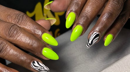 Bright green nails with zebra print at Sheia’s nail gallery, Nassau, New Providence, BS.