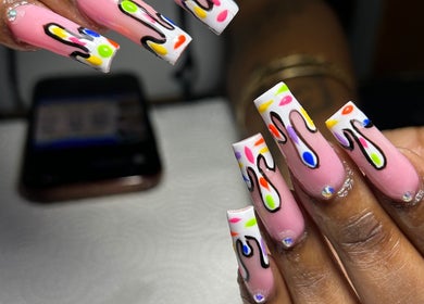 Vibrant drip nail art at Sheia’s nail gallery, Nassau, New Providence, BS showcasing creative designs.