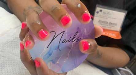 Bright pink nails at MANifest Lounge, Detroit, Michigan, US. Personalized nail care session.