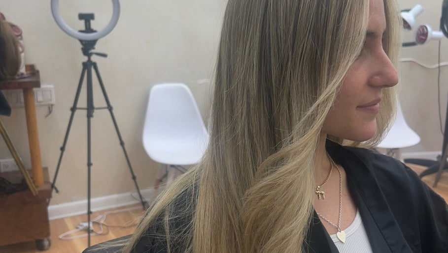 Blonde hair styling at Hairbystellalalo in Long Branch, New Jersey, US. Sleek and elegant look.