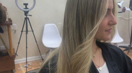 Blonde hair styling at Hairbystellalalo in Long Branch, New Jersey, US. Sleek and elegant look.