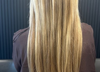 Long, straight blonde hair styled at Hairbystellalalo in Long Branch, New Jersey, US.