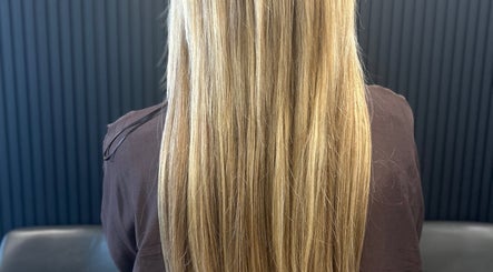 Long, straight blonde hair styled at Hairbystellalalo in Long Branch, New Jersey, US.