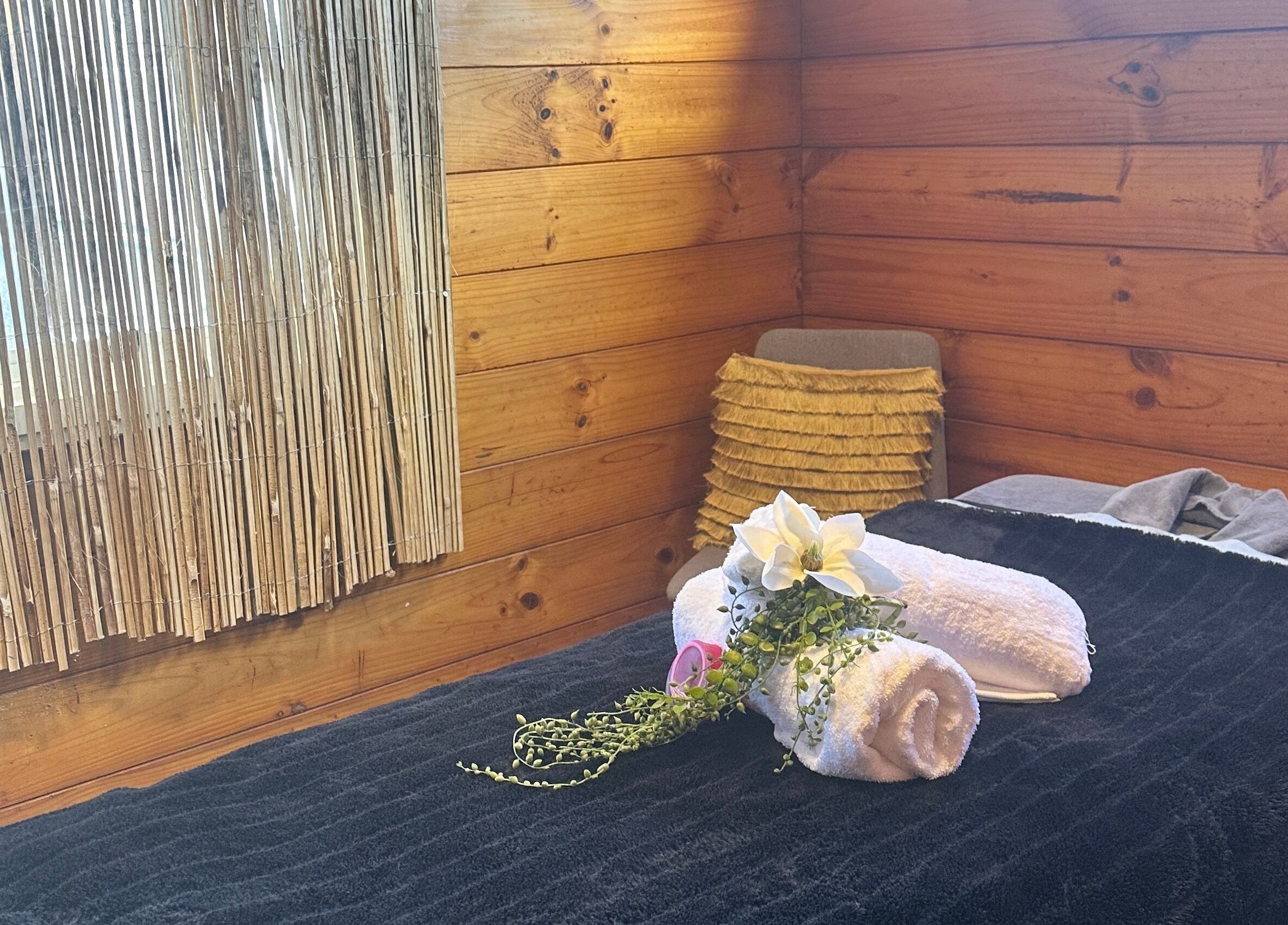 Waipu Treatment Room in Waipu, Northland Region, NZ. A tranquil wood-themed spa setup for relaxation.