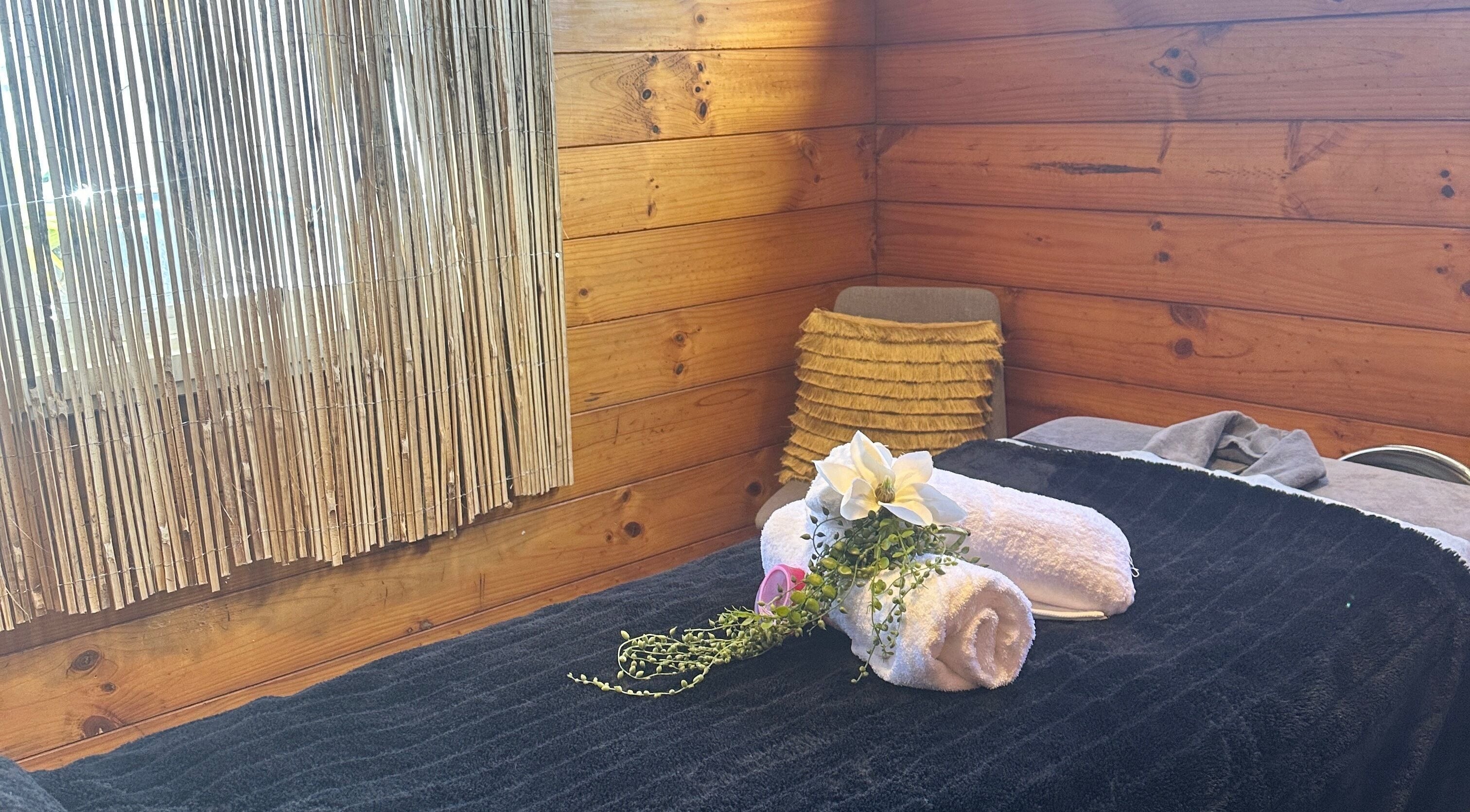 Waipu Treatment Room in Waipu, Northland Region, NZ. A tranquil wood-themed spa setup for relaxation.