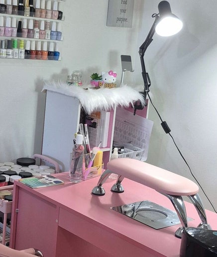 Modern nail station at Nails by Lucia, Miami, Florida, US, showcasing an elegant setup with polishes and tools.