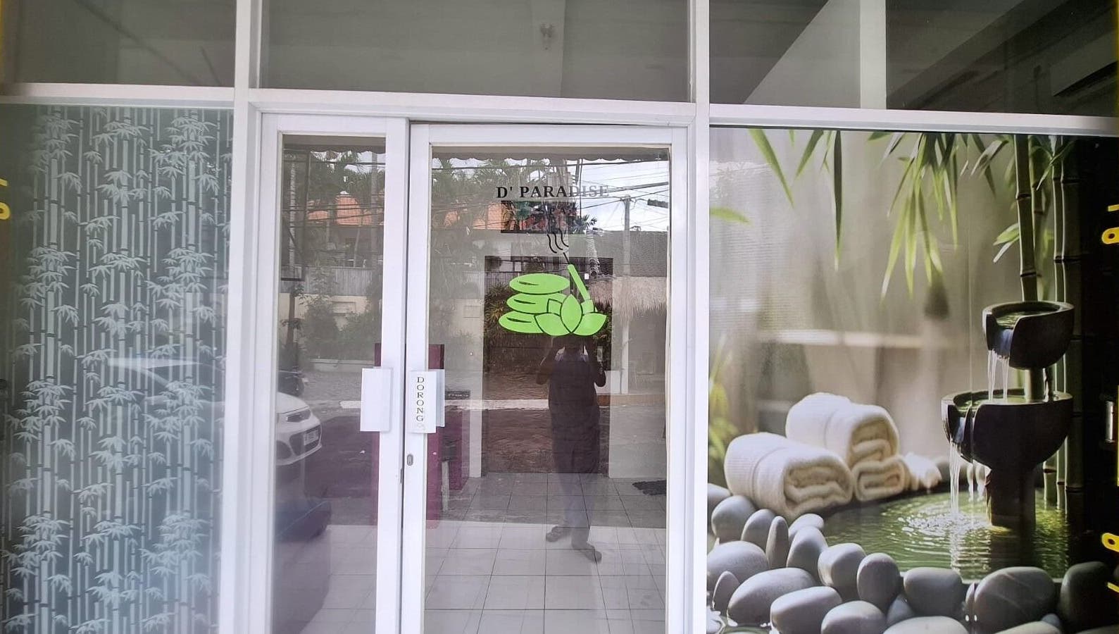 Entrance of D' Paradise SPA in Bali, Bali, ID with bamboo and stone decor elements.