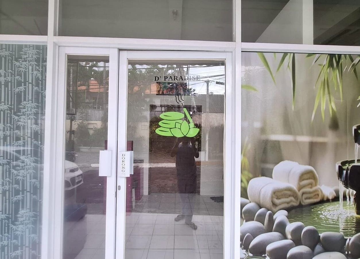 Entrance of D' Paradise SPA in Bali, Bali, ID with bamboo and stone decor elements.