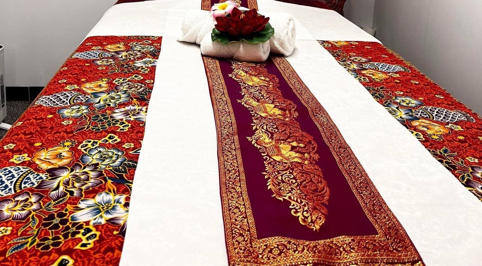 Decorative massage bed at Mol Thai Therapy, Doncaster, England, GB with vibrant floral design.