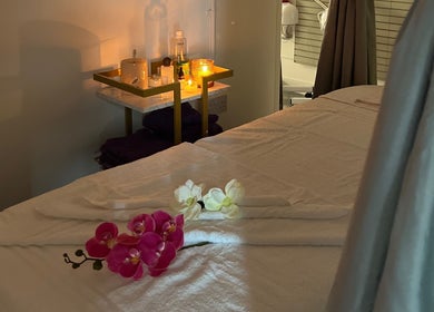 Cozy massage room with candles and flowers at Mol Thai Therapy, Doncaster, England, GB.