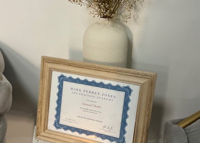 Certificate and vase displayed at Mol Thai Therapy, Doncaster, England, GB, showcasing elegance and professionalism.