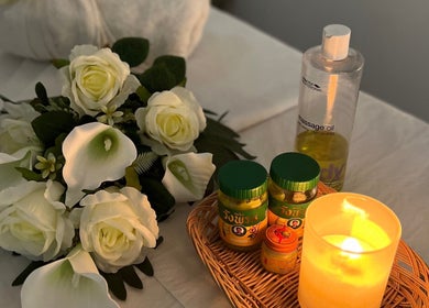 Mol Thai Therapy in Doncaster, England, features elegant flowers and massage oils for a calming experience.