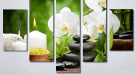 Relaxing spa setting at Adriatic Miracle Spa Massage, Folsom, California, US with candles and stones.