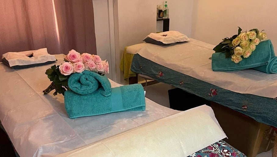Luxury massage beds with roses at Magic Touch Thai Massage, The Rocks, New South Wales, AU.