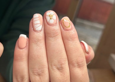 Elegant floral nail art at Beauty Lounge by Isabelle in Penygroes, Wales, GB, showcasing delicate designs.