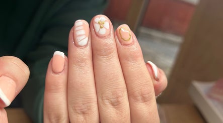 Elegant floral nail art at Beauty Lounge by Isabelle in Penygroes, Wales, GB, showcasing delicate designs.