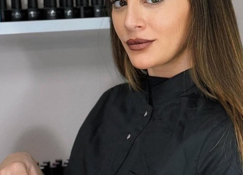 Beauty expert at Simona Minov in San Ġwann, MT, showcasing premium salon products.
