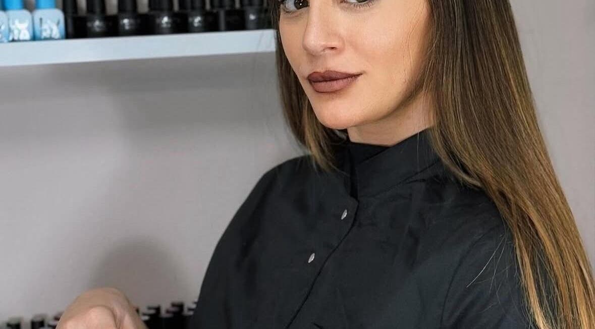 Beauty expert at Simona Minov in San Ġwann, MT, showcasing premium salon products.