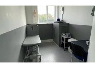 Calming therapy room at MH Sports Massage, London, England, GB with an adjustable treatment table.