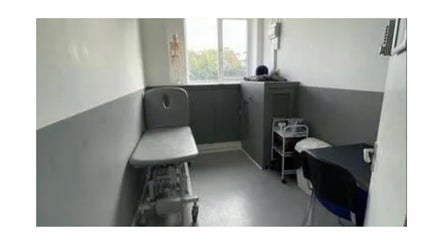 Calming therapy room at MH Sports Massage, London, England, GB with an adjustable treatment table.