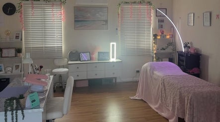 Elegant beauty room at Dollhaven_co in Walmsley, Western Australia, AU featuring a treatment bed and chic decor.