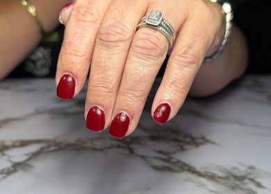 Elegant red manicure at Dollhaven Co, Walmsley, Western Australia, AU, showcasing polished nails.