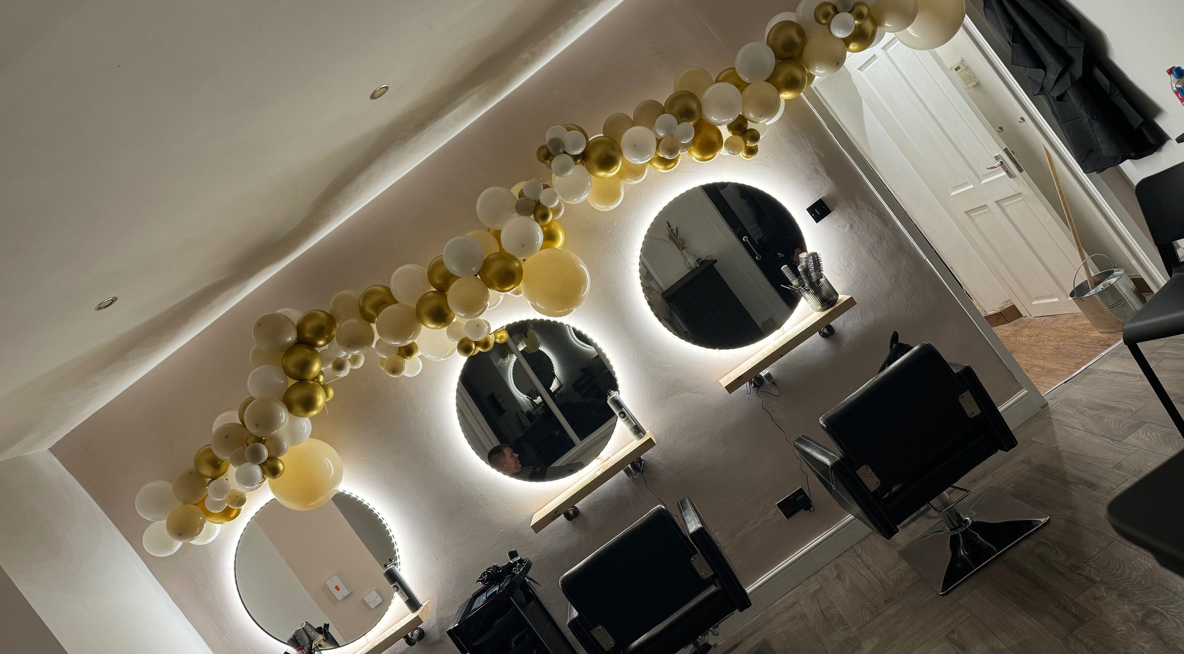 Luxurious salon interior at No3 Hair & Beauty, Worsley, England, GB with elegant mirrors and balloon decor.
