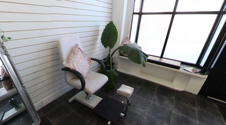 Comfortable chair and greenery at Sophie At Beauty Haven, March, England, GB.