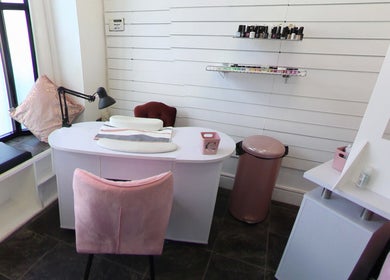 Modern nail station at Sophie At Beauty Haven, March, England, GB, with elegant decor and nail polish display.