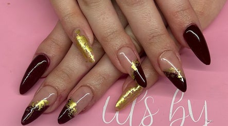 Stylish burgundy nails with gold accents at La - Fabulous, Boksburg, Gauteng, ZA.