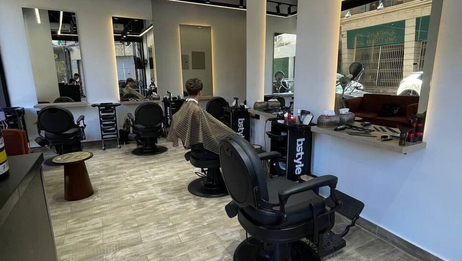 Interior view of Mohamed Gaber Salon in Alexandria Governorate, featuring modern salon chairs and styling stations.