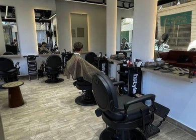 Interior view of Mohamed Gaber Salon in Alexandria Governorate, featuring modern salon chairs and styling stations.