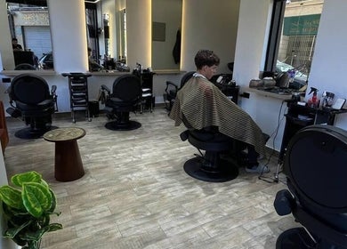 Interior view of Mohamed Gaber Salon in Alexandria Governorate, showcasing stylish seating and modern decor.