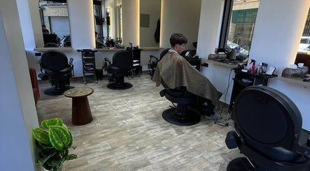 Interior view of Mohamed Gaber Salon in Alexandria Governorate, showcasing stylish seating and modern decor.
