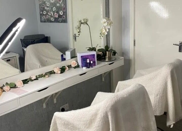 Elegant beauty station at Claws Out in Warrington, England, GB, with flowers and professional equipment.