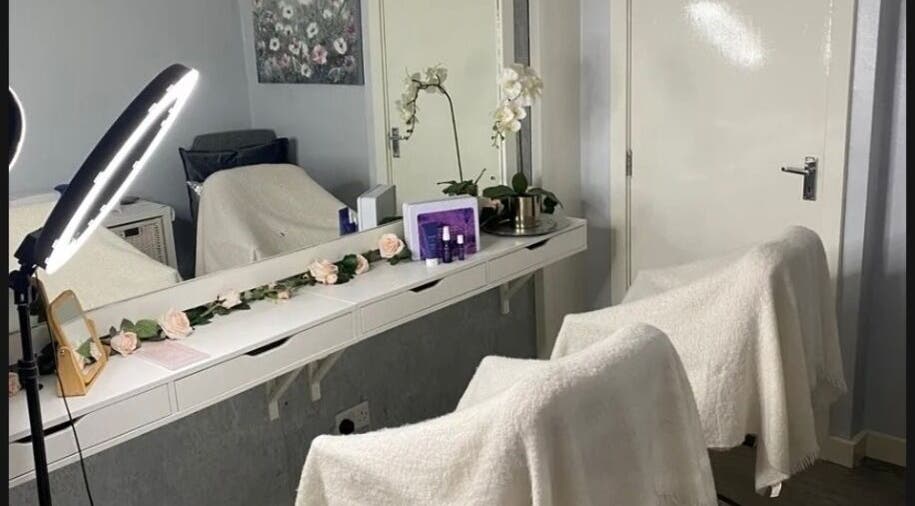 Elegant beauty station at Claws Out in Warrington, England, GB, with flowers and professional equipment.